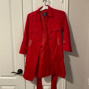 Red trench coat with rhinestone embellishments